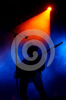 Stage with smoke and guitar player