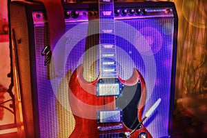 `On Stage` vintage guitar and amplifier on wood floor stage