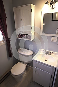 Staged light colored bathroom for residential real estate