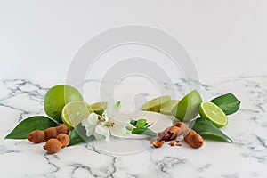 A staged mock up with sweet tamarind, green lemon and some blooms for advertising