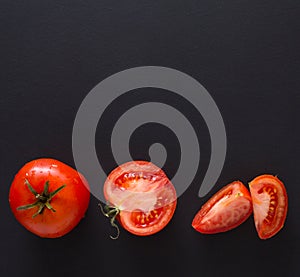 Stages of cutting tomato on black background