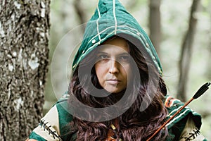 Staging photo of beautiful woman in fantasy suit with hood
