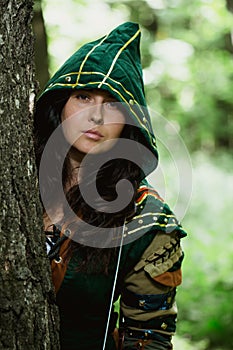 Staging photo of beautiful woman in fantasy suit with hood