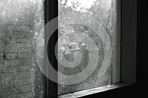 Stain and dust on glass window frame in home with monochrome tone
