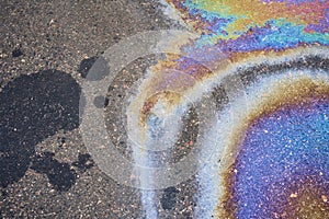 Stained Asphalt from Oil, Colorful Gasoline Fuel Marks on Road as Texture or Background