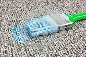 Stained carpet with paint brush