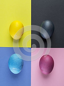 Stained Easter eggs as an attribute of Easter celebration on colorful background