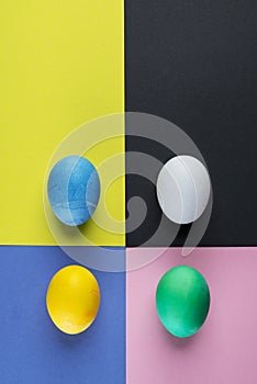 Stained Easter eggs as an attribute of Easter celebration on colorful background