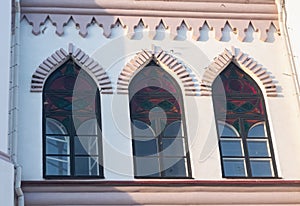 Stained glass arched windows in the Gothic style. Architectural elements