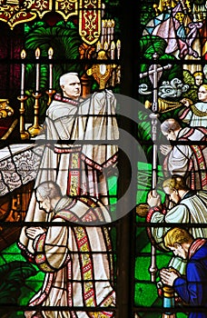 Stained Glass - a bishop holding a Monstrance