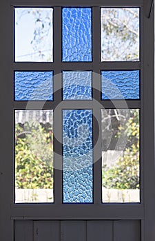 Stained Glass Cross Framed in a Window