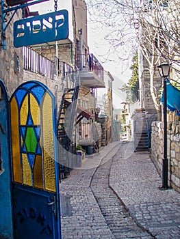 Stained glass door with magen david on the narrow street of Jerusalem. Israel.