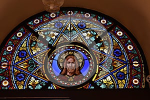 Stained glass with the image of Jesus Christ.