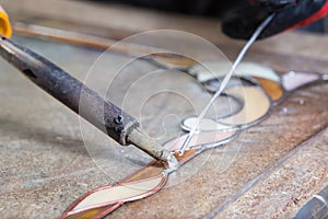 Stained glass maker works with souvenirs