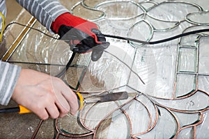 Stained glass maker works with souvenirs