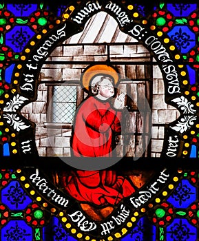 Stained Glass - Saint Conteste praying