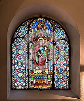 Stained glass window in an arched alcove in the church of Saint Severus in Boppard, Germany