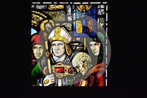 Stained glass window art by Harry Clarke depicting the consecration of Saint Mel as Bishop of Longford