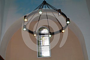 Stained glass window and church lamp
