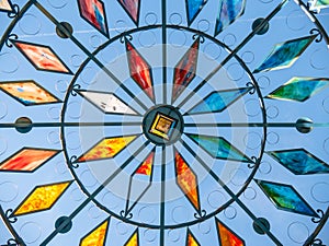 Stained glass window with colored crystals