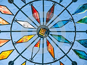 Stained glass window with colored crystals