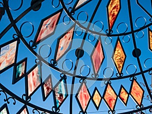 Stained glass window with colored crystals of blue, red, orange