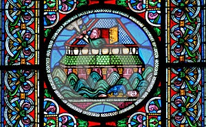 Stained glass window depicting Noahs Ark on the water