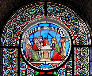 Stained glass window depicting the rainbow at the end of Noahs photo