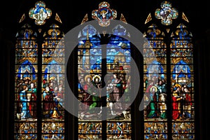 stained glass window, depicting a religious scene, in medieval cathedral