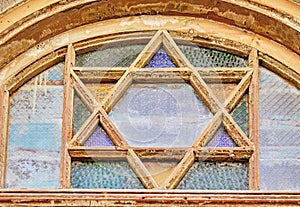 Stained glass window with magen david in an old restored house