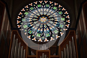Stained glass window with organ pipes
