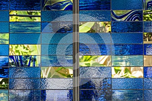 Stained glass window pattern with a blue tone, close up