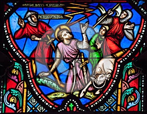 Stained glass window of Paulus falling of his horse