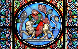 Stained glass window Samson slaying the lion