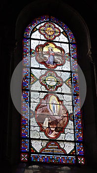 Stained glass window of Sanctuary of Our Lady of Lourdes in the Pyrenees, France