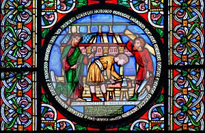 Stained glass window showing the building of Noahs Ark photo