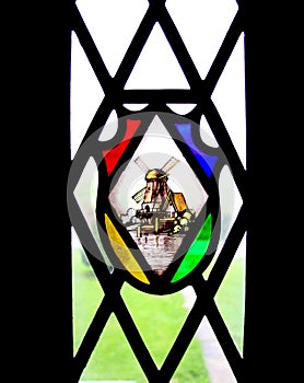 Stained glass window with windmill inset.
