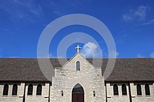 Stained Glass Windows and Cross on Church Steeple of Old Christi