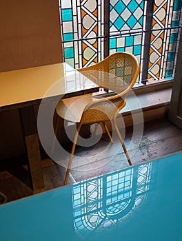 Stained glass windows let light into a cafe in a deconsecrated, restored church in Mayfair, London, UK.