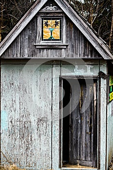 Stainglass Window On An Old Shed.