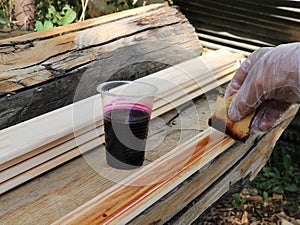 staining with a sponge with a solution of manganese wood panels