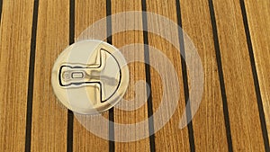 Stainlass steel Deck fitting and teak decking background