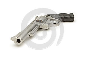 Stainless 357 Magnum Revolver Cocked on White