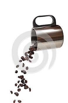 Stainless coffee cup pouring brown coffee beans isolated on a white