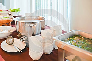 stainless pot of boiled rice , ready for serving customer