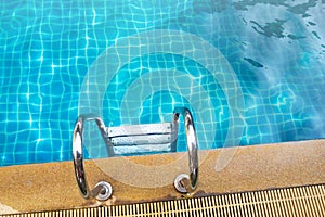Stainless rail in swimming pool. Water activity