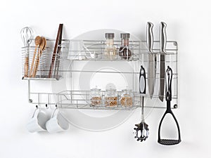 Stainless shelf with kitchen utensil