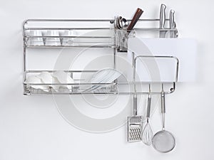 Stainless shelf with kitchen utensil