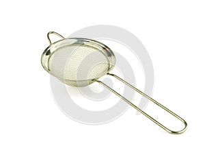 Stainless sieve flour on white