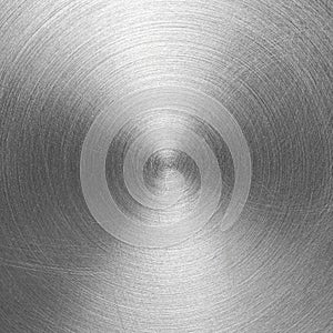 Stainless steel or aluminium circular brushed shiny metal texture. Abstract metallic background. Circle shape.
